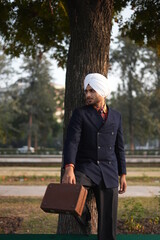 person sitting on a bench in park