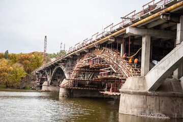Scaffolding with a support system of beams at the reconstruction of the bridge.