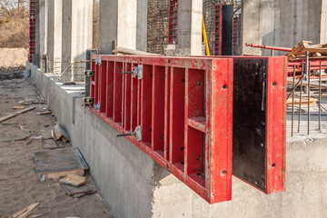 Formwork panels and crane at industrial construction.