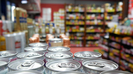 Close-up of many beautiful cans with beverage in a liquor shop