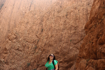 Tourist woman enjoying the landscape in the Todra Gorge of Morocco