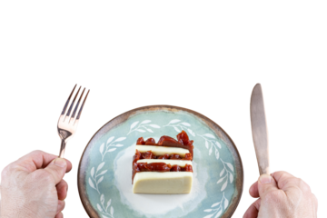 Man with a copper knife and fork ready to eat slices of guava sweet and curd cheese (PNG).