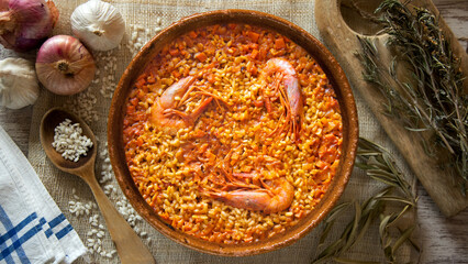 Traditional Spanish paella with red prawns from Ibiza. Typical recipe with seafood from the famous Spanish tapa.
