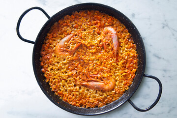 Traditional Spanish paella with red prawns from Ibiza. Typical recipe with seafood from the famous Spanish tapa.