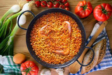 Traditional Spanish paella with red prawns from Ibiza. Typical recipe with seafood from the famous Spanish tapa.