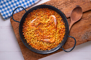 Traditional Spanish paella with red prawns from Ibiza. Typical recipe with seafood from the famous Spanish tapa.