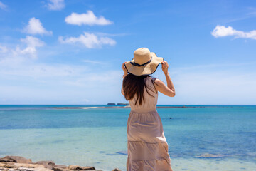 Fototapeta na wymiar Travel woman go to the beach in Penghu of Taiwan