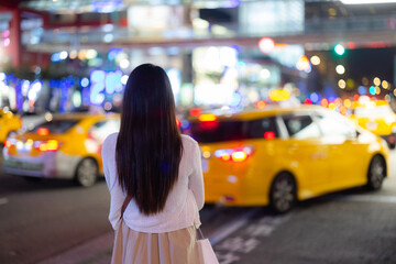 Travel woman in the Taipei city street at night