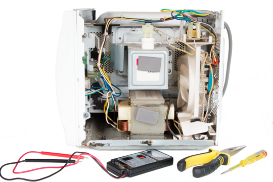 disassembled microwave oven, magnetron repair, on an isolated background