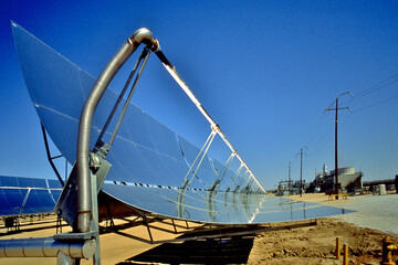 A Parabolic trough concentrate sunlight onto a receiver tube filled with liquid to temperatures between 500-700 K. These hot liquids go to a heat exchange turning water to steam that power turbines 