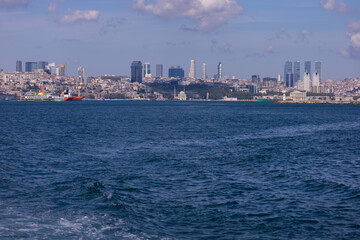 Fototapeta premium silhouette Istanbul city buildings from water Bosphorus or Golden Horn, public places.