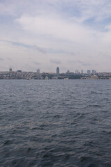 Naklejka premium silhouette Istanbul city buildings from water Bosphorus or Golden Horn, public places.