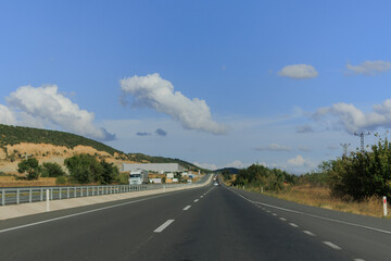 Highway wide road, transport and blue sky with clouds on a summer day