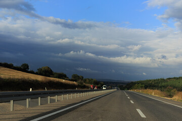 Highway wide road, transport and blue sky with clouds on a summer day