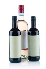 Few red wine bottles close up isolated on white background