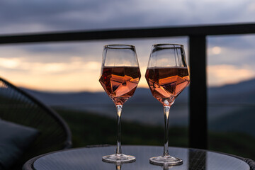 glasses of wine in mountains, closeup