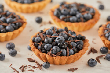 dessert with blueberries and chocolate on a light background