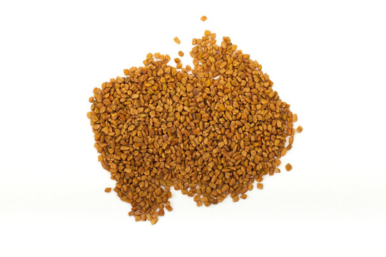 Fenugreek seeds, spices close-up as a background flat lay. Indian and Arabic spices for cooking. Medicinal herbs and condiment.