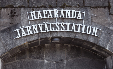 Close-up view of the sign at the entrance to the Haparanda railroad station..