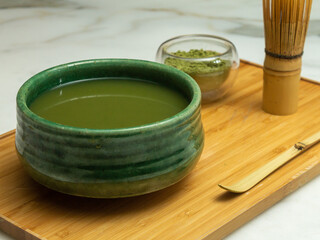 green tea in a glass jar