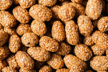 Sesame coated peanuts with honey and molasses, traditional turkish nut