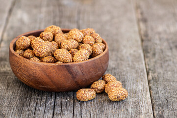 Sesame coated peanuts with honey and molasses, traditional turkish nut