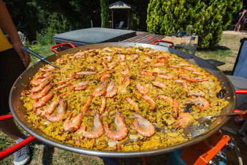 Giant plate of paella with big shrimps