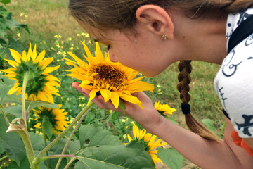child with sunflower