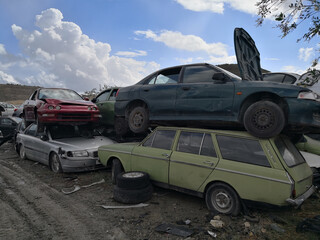 Fototapeta na wymiar The scrap yard with old cars of crushed cars