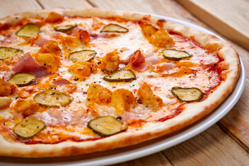 tasty pizza on the wooden background