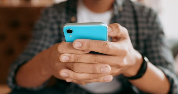 Hands, phone and man texting and relax, rest on a sofa at home on the weekend. Social media, streaming and closeup of hand typing, internet search for online entertainment or fun dating social app