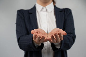 Obraz premium Close-up of caucasian woman holding her palms up. 