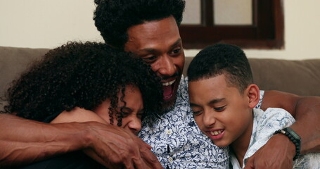 African father hugging his kids, candid and authentic family love and care