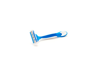 Single brand new blue and white plastic disposable razor with ergonomic handle isolated on white background