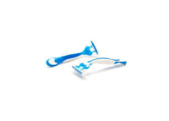 Two brand new blue and white plastic disposable razors with ergonomic handle isolated on white...