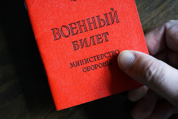 Certificate of Russian serviceman, military ID in hand, top view