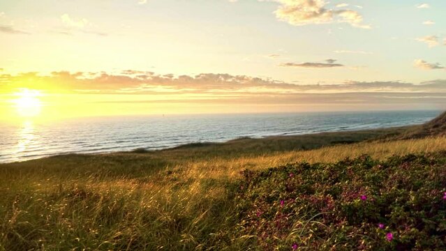 A beautiful tranquil view of the shore and North Sea at sunrise. Sylt, Germany