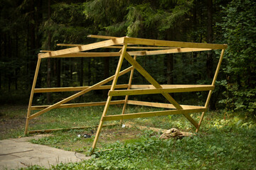 Wooden building in forest. Structure of boards. Details of unsuccessful construction.