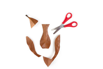 step by step instruction autumn craft for kids, leave and scissors on white background