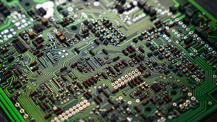 Closeup shot of detailed PCB board with lots of different electric components. The heart of modern electric devices. . High quality photo