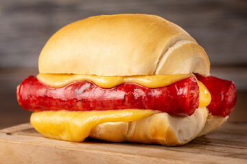 Sausage sandwich with melted cheese.