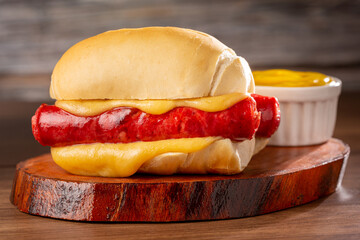 Sausage sandwich with melted cheese.