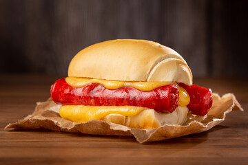 Sausage sandwich with melted cheese.