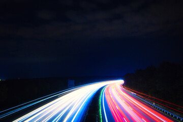 Fototapeta na wymiar Speed Traffic - Highway at Night - Cars - Nachtverkehr auf Autobahn - Light Trails - Datenautobahn - Speeding - German - Ecology - Long Exposure - High quality photo