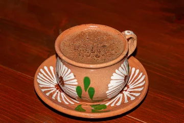 Foto op Canvas Traditional hot chocolate in a clay mug © mardoz