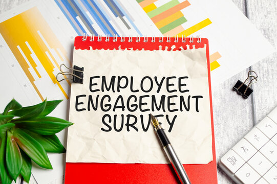 EMPLOYEE ENGAGEMENT SURVEY text written on paper folder and charts