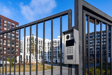 Electronic lock with buttons and intercom on the metal fence gate, safety device.