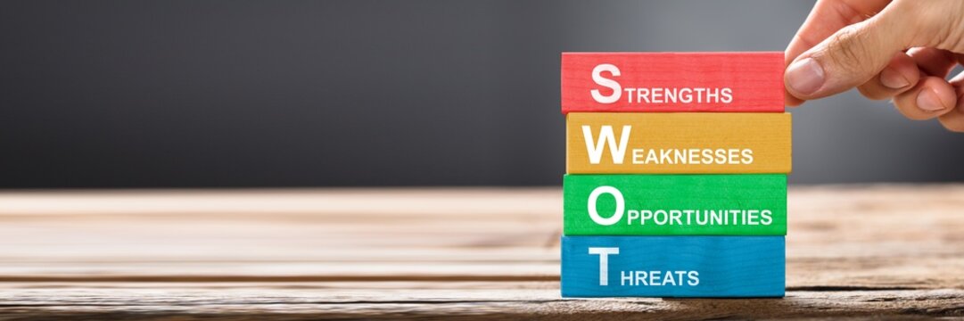 Hand Building Colorful SWOT Concept With Wooden Blocks