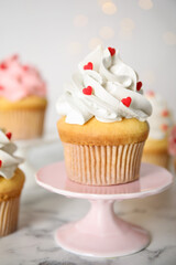 Tasty sweet cupcake on stand, closeup. Happy Valentine's Day