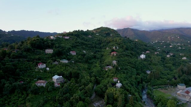 Aerial view on village in mountains near to the sea. High quality 4k footage